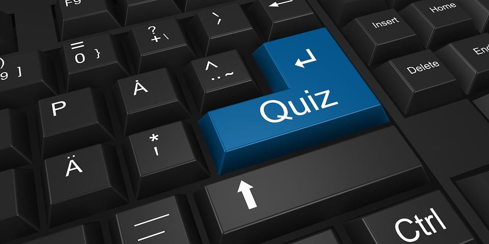 keyboard-with-a-blue-button-saying-quiz